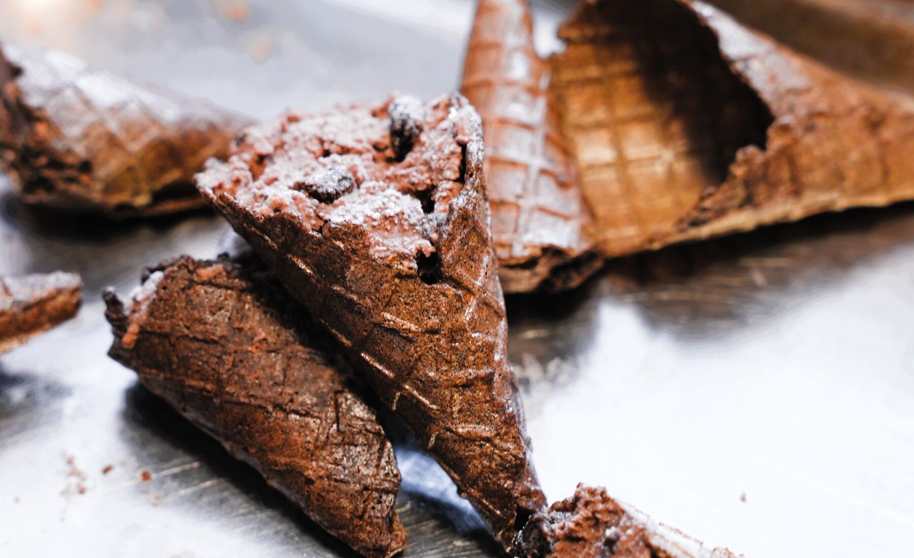 Chocolate Frozen Hemptation waffle-cone prototypes arranged on a preparation surface